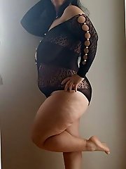 A plump older woman is opening her mouth for payment