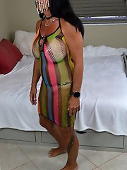 Experienced dominant woman prepares for sexual encounter
