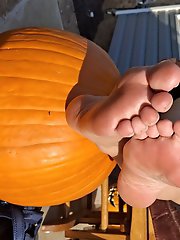 Pumpkin sitting on a footstool