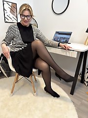 Pretty blonde mature Diana at the office in black pantyhose a steamy scene